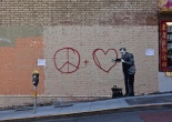 a bit of urban art depicting a doctor listening to a heart, which is drawn onto a brick wall in the San Francisco Area